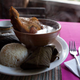 Kaq-ik is served with rice, tamales, and a turkey leg that you dip into the stew.